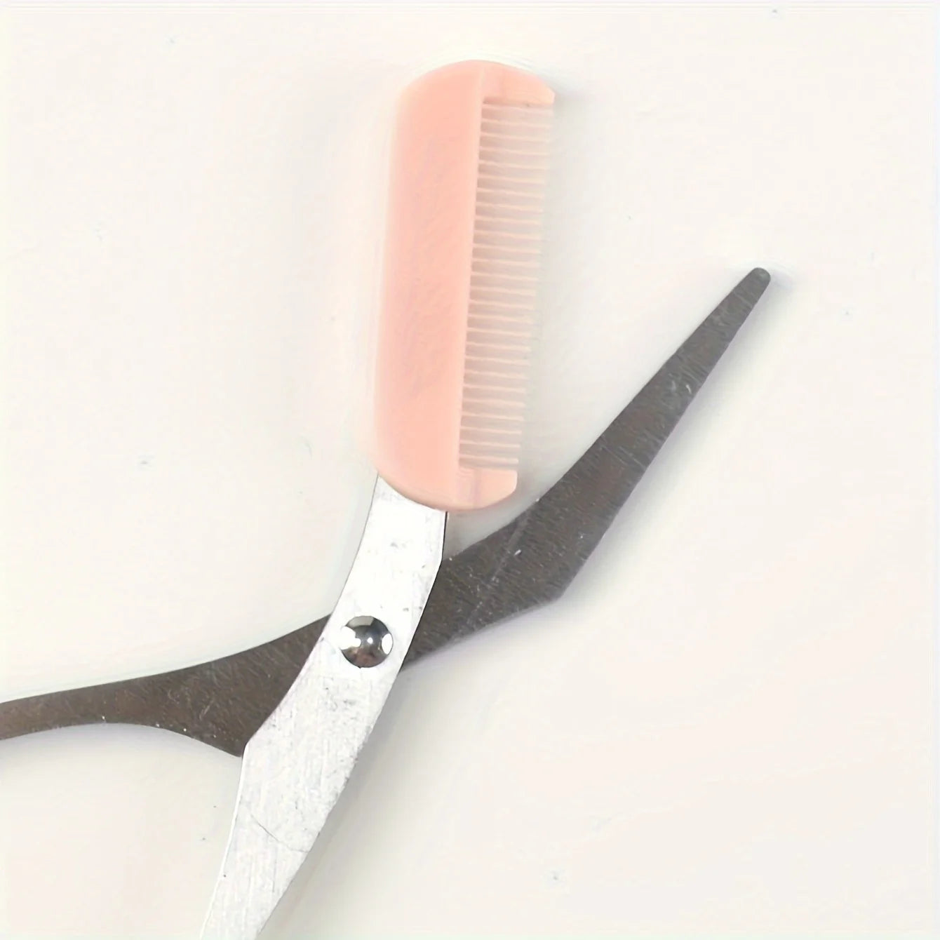 Eyebrow trimming scissors with built-in comb